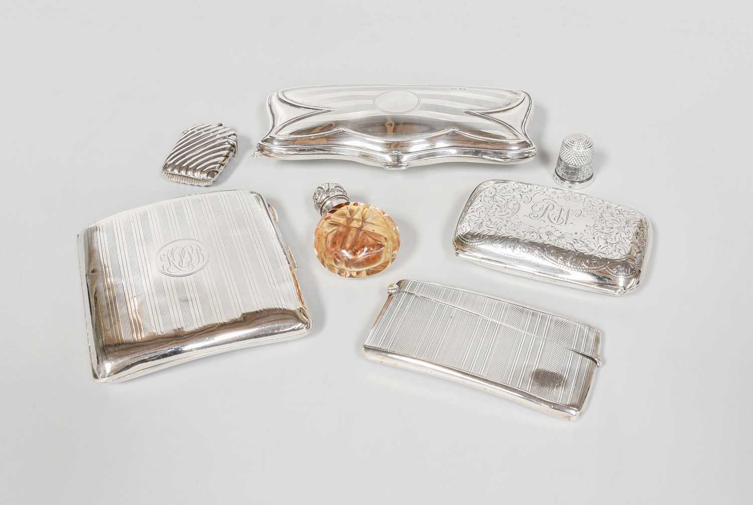 A Collection of Assorted Silver, including two cigarette-cases, one with engine-turned decoration,