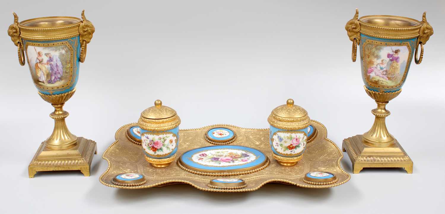 A French Gilt Metal Encrier With Sèvres Style Porcelain Mounts, engraved with scrollwork and