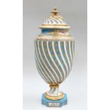 A Sèvres Style Porcelain Urn, early 20th century, wrythen moulded and with gilt metal mounts, blue