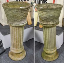 A Pair of Composite Garden Planters, basketwork effect, raised on fluted column plinths, 104cm by