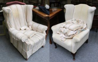 A Pair of Mahogany Framed Wing Back Armchairs, early 20th century (in need of restoration), raised