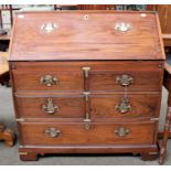 A 19th Century Camphor Wood Campaign Bureau, with fall flap, fitted interior, brass mounts, four