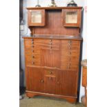 An Early 20th Century Mahogany Dentistry Cabinet, the upper section with two small glazed cupboards,