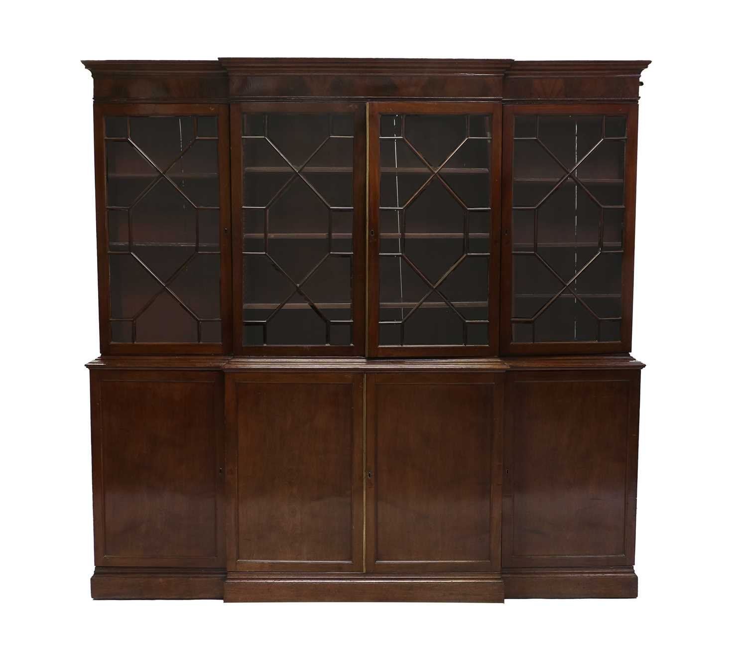 A Late George III Mahogany Four-Door Breakfront Library Bookcase, early 19th century, the moulded