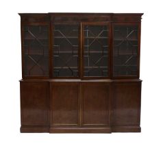 A Late George III Mahogany Four-Door Breakfront Library Bookcase, early 19th century, the moulded