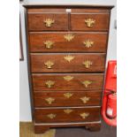 A 19th Century Oak Six Height Chest of Drawers, shaped brass handles and escutcheons, bracket