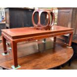 A Chinese Hardwood Rectangular Coffee Table, stylised carvings, square legs, 41cm by 127cm by