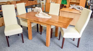 A Contemporary Light Oak Folding Dining Table, the cleated rectangular top raised on square legs,