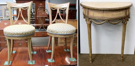 A Pair of French Painted Salon Chairs, pierced swag backs, over stuffed seat, tapered outswept legs;