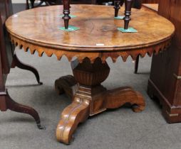 A 19th Century Walnut Veneer Centre Table, of circular form with shaped lancet apron, raised on