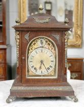 An Oak Cased Table Clock, twin train 8 day movement, arched Roman dial, gilt mount, 42cm high