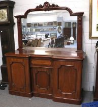 A Victorian Mahogany Mirror Back Sideboard, carved pediment, inverted breakfront with drawer and