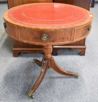 A Georgian Style Mahogany Drum Table, with red leather inset, three drawers and three dummy drawers,