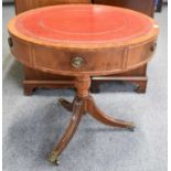 A Georgian Style Mahogany Drum Table, with red leather inset, three drawers and three dummy drawers,