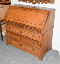 A 19th Century North European Inlaid Oak Bureau, the fall front opening to reveal a parquetry inlaid