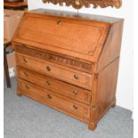 A 19th Century North European Inlaid Oak Bureau, the fall front opening to reveal a parquetry inlaid