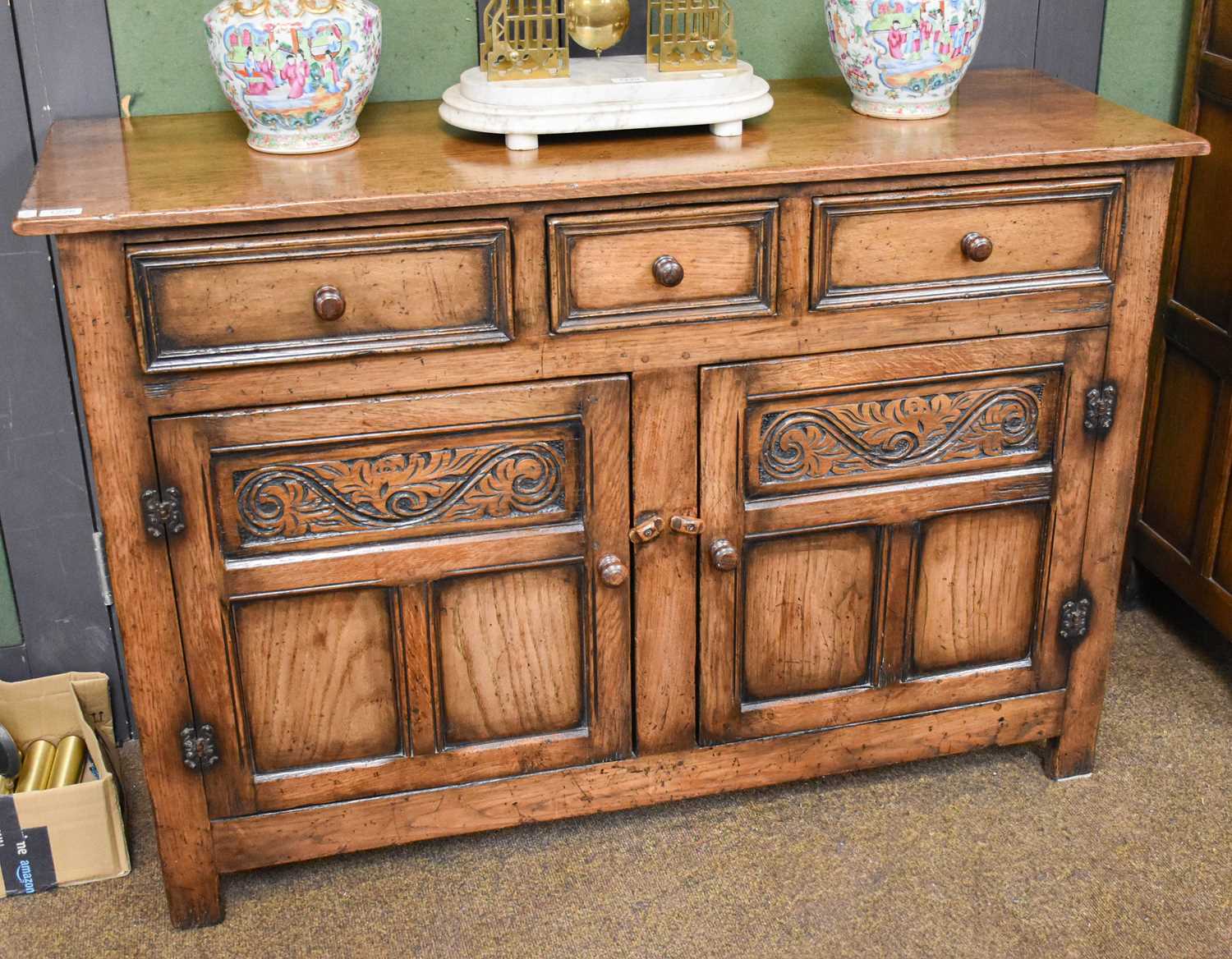 An Oak Reproduction Dresser Base, in the style of Titchmarsh & Goodwin, three drawers over twin