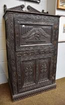 A 17th century Style Oak Cupboard, some earlier timbers, bearing date 1694, with two cupboard