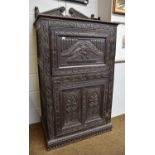 A 17th century Style Oak Cupboard, some earlier timbers, bearing date 1694, with two cupboard