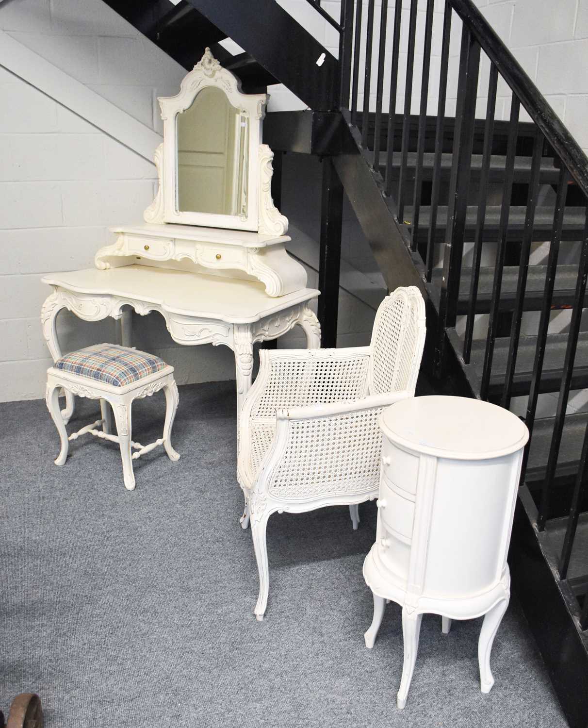 A French Style White Painted Mirror Back Dressing Table, a wall hanging mirror, a stool, a bergere