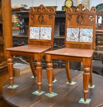 A Pair of Late 19th century Mahogany Hall Chairs, pierced carved backs, each inset with two Minton