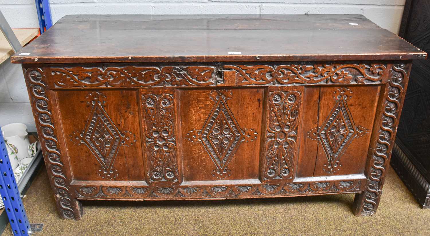 An late 17th/Early 18th century Oak Coffer, hinged lid, panelled front and sides, carved scroll - Image 3 of 3