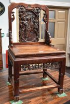 A Late 19th Century Chinese Heavily Carved Hardwood Chair, with stylised figural splat, solid