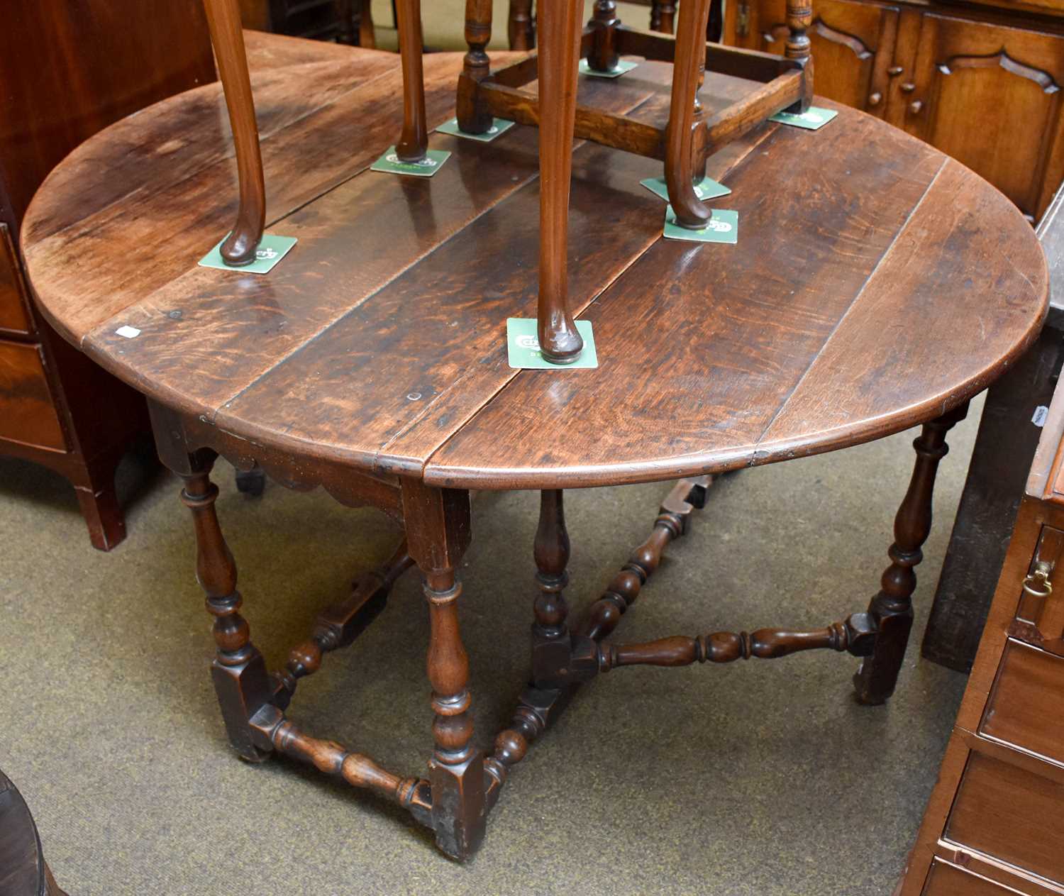 A 17th century Gateleg Table, oval top, twin drop leaves, baluster turned legs and stretchers with