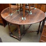 A 17th century Gateleg Table, oval top, twin drop leaves, baluster turned legs and stretchers with