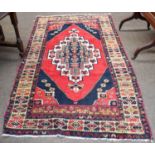 Anatolian Rug, the blood red lozenge field centred by a stepped diamond medallion flanked by