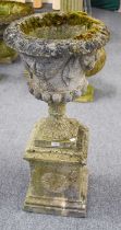A Composite Neo Classical Garden Urn, with relief fruit and swag decoration, raised on square plinth