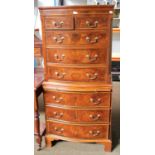 A Reproduction Georgian Style Walnut and Mahogany Chest on Chest, two short over six long drawers