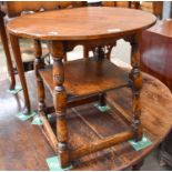 A Titchmarsh & Goodwin Style Oak Coffee Table, circular top, raised on turned supports with under