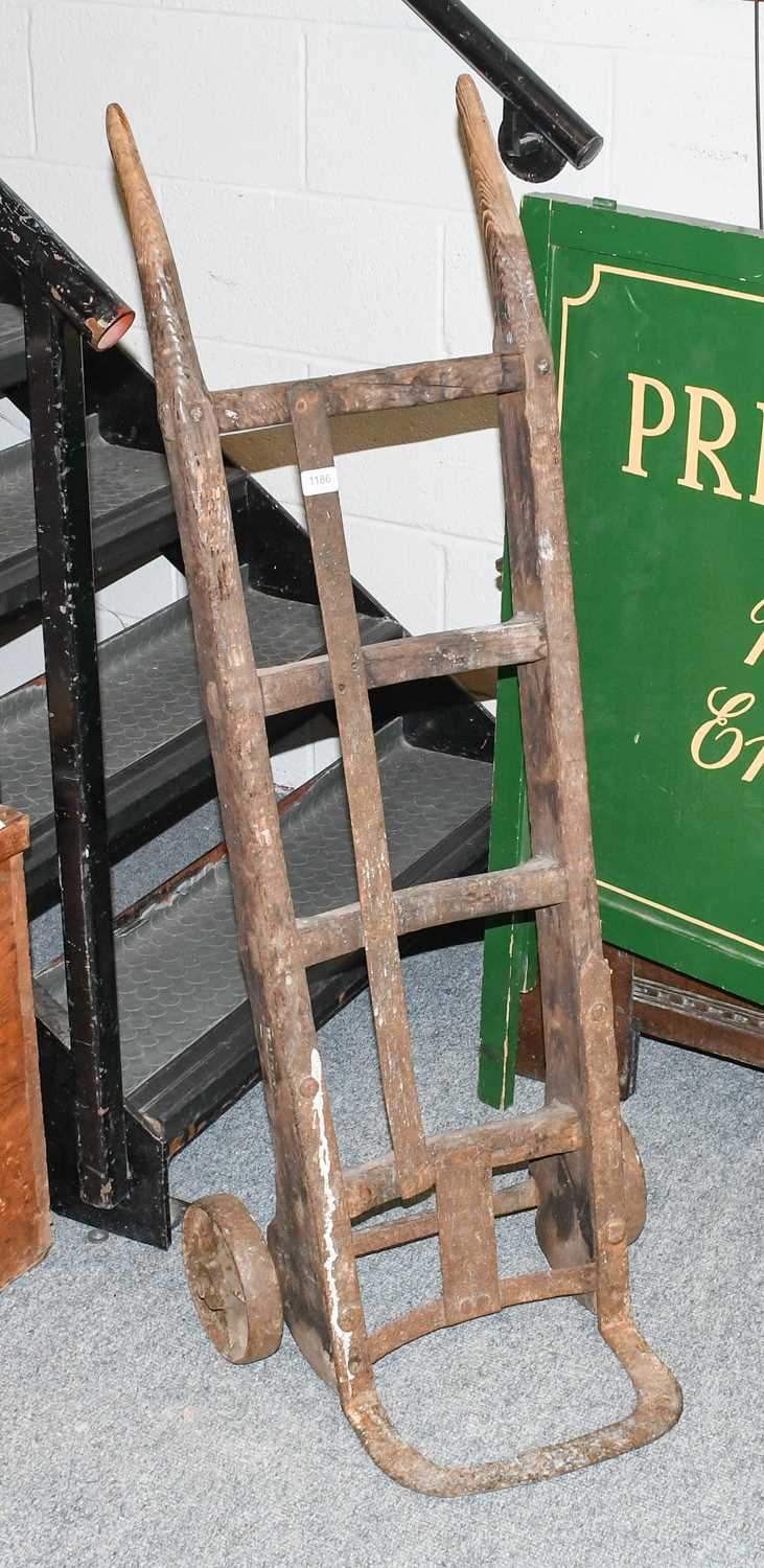 A Late Victorian Porter's Sack Barrow, stamped Watkins; together with a pine apple tray rack,