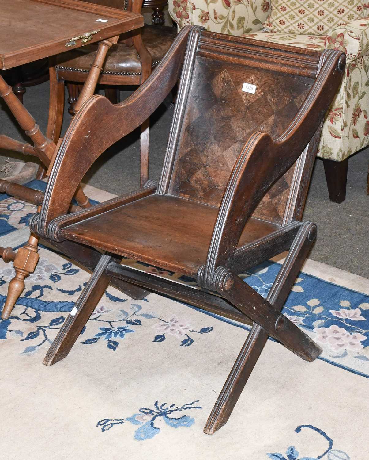 A Victorian Parquetry Inlaid Oak Glastonbury Chair, solid back and seat, on X-frame