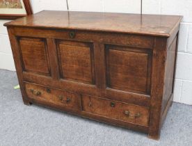 An 18th Century Three Panelled Oak Mule Chest, hinged lid, two drawers to base, 122cm by 50cm by