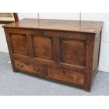 An 18th Century Three Panelled Oak Mule Chest, hinged lid, two drawers to base, 122cm by 50cm by