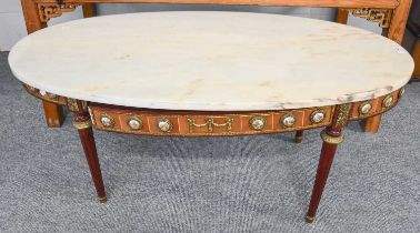 A French Style Oval Marble Topped Coffee Table, elaborate gilt metal mounts and porcelain roundels