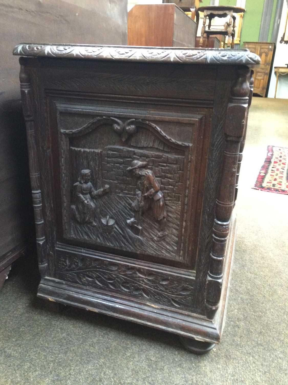 A Carved Oak Chest, some earlier timbers, with hinged lid, elaborate figural panels to the front and - Image 3 of 8