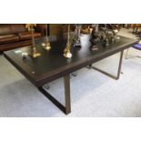 A Modernist Stained and Faux Leather Inset Dining Table, on brushed metal supports, 230cm by 90cm by