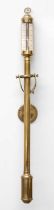 A Reproduction Brass Stick Barometer, on gimbal wall mount, silvered dial, 96cm high