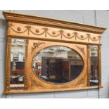 A 19th century Style Gilt Overmantle Mirror, of architectural form with central oval plate,