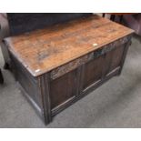 A Late 17th Century Oak Coffer, with hinged lid, carved foliate scroll frieze, on stile ends, 63cm