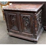 A Carved Oak Chest, some earlier timbers, with hinged lid, elaborate figural panels to the front and