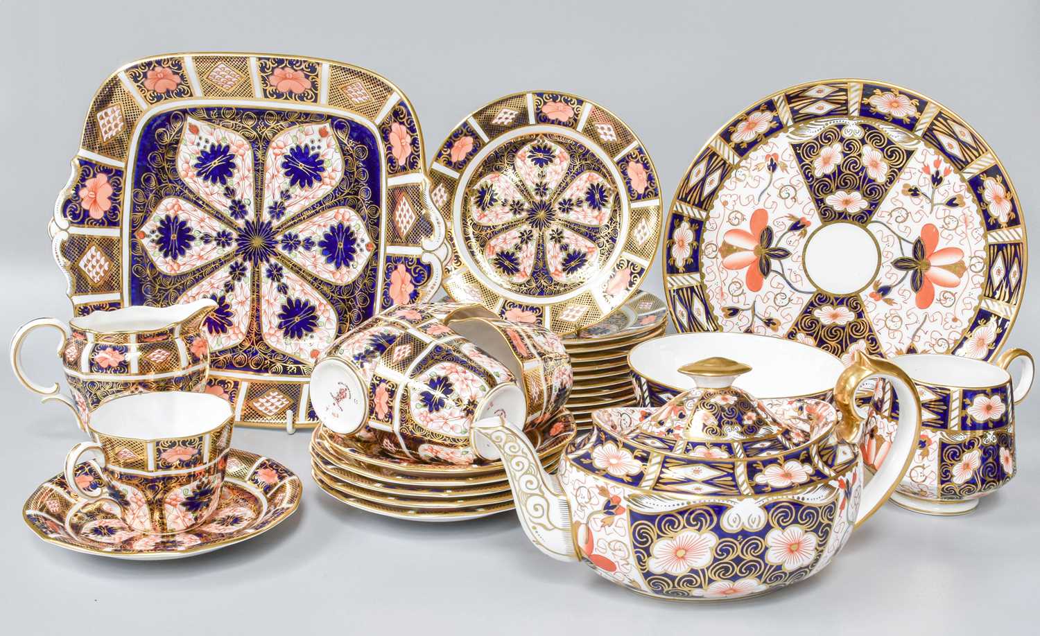 A Selection of Royal Crown Derby Imari Pattern Items, tea cups and saucers, plates, teapot etc. (two