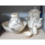 A Doulton Chamber Set Jug - 27cm high Significant cracks and stapled repairs to lidded twin