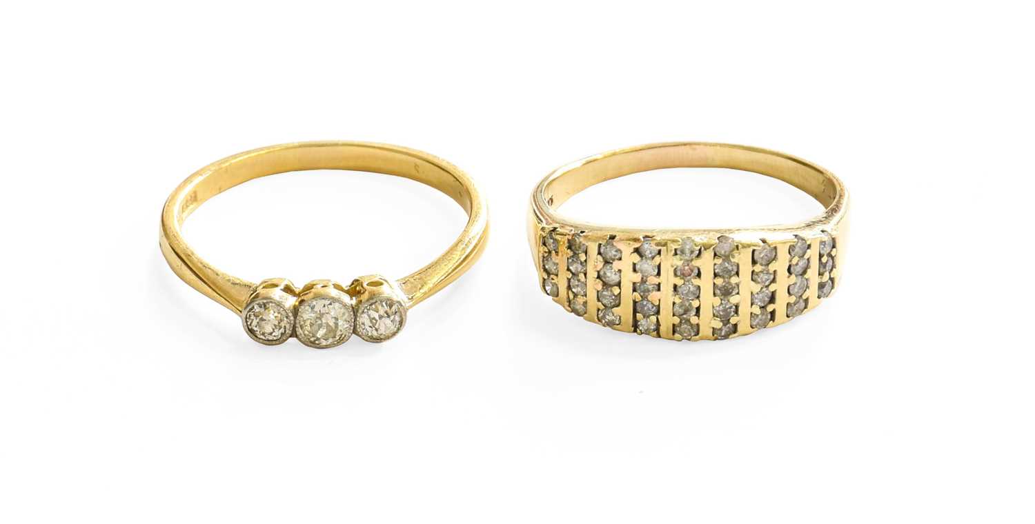 A 9 Carat Gold Diamond Dress Ring, comprising of nine rows of round brilliant cut diamonds in yellow