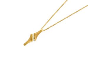 An 18 Carat Gold Diamond Pendant on Chain, three round brilliant cut diamonds in a yellow plain