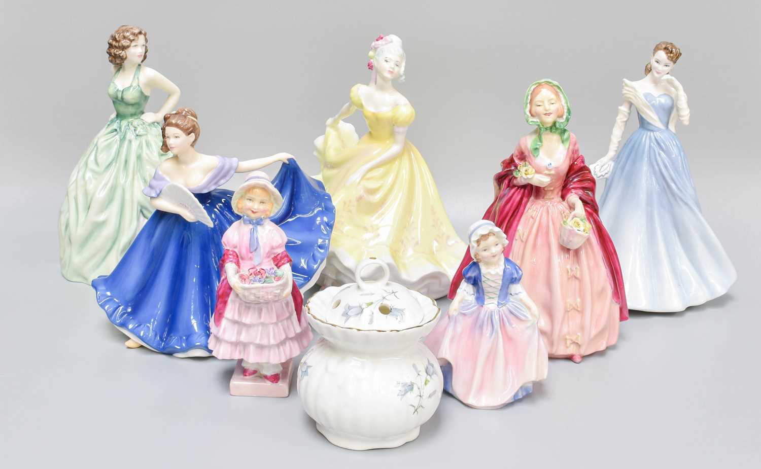 Seven Royal Doulton Porcelain Figures of Ladies; together with a porcelain posy bowl (one tray)