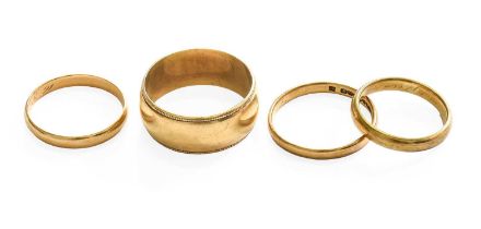 Three 9 Carat Gold Band Rings, finger sizes J1/2, P1/2 and T1/2; and Another Band Ring, stamped '